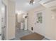 Well-equipped laundry room with washer, dryer, water heater, and access to the exterior at 8851 Sw 116Th Street Rd, Ocala, FL 34481