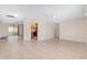 Bright, open living room featuring tile floors, ceiling fan, and natural light at 8851 Sw 116Th Street Rd, Ocala, FL 34481