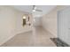 Open-concept living room features tile floors, neutral walls, and kitchen view at 8851 Sw 116Th Street Rd, Ocala, FL 34481