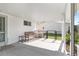 Covered patio offers outdoor seating area and view of the back yard at 8851 Sw 116Th Street Rd, Ocala, FL 34481
