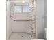 Accessible shower with grab bars and tiled surround in a modern bathroom at 8851 Sw 116Th Street Rd, Ocala, FL 34481