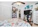 Cozy bedroom featuring a closet with louvered doors, a ceiling fan, and a flatscreen television at 8851 Sw 97Th St # A, Ocala, FL 34481