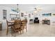 Bright dining area features coastal decor, fan, and a dining table, perfect for gatherings at 8851 Sw 97Th St # A, Ocala, FL 34481