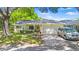 Charming single-story home with a well-manicured lawn, mature trees and an attached two-car garage at 8851 Sw 97Th St # A, Ocala, FL 34481