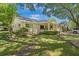 Charming single-story home with manicured front lawn, covered porch, and mature trees at 8851 Sw 97Th St # A, Ocala, FL 34481