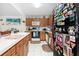 Kitchen with wooden cabinets, white appliances, and a functional layout at 8851 Sw 97Th St # A, Ocala, FL 34481