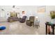 Bright living room featuring tile floors, a sofa, and comfortable chairs, perfect for relaxation at 8851 Sw 97Th St # A, Ocala, FL 34481