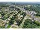 An aerial shot showcases the neighborhood's layout, highlighting its convenient access to nearby roads and local amenities at 8954 Sw 104Th Ln, Ocala, FL 34481