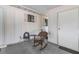 Relaxing back porch with a rocking chair, perfect for enjoying quiet moments outdoors at 8954 Sw 104Th Ln, Ocala, FL 34481
