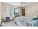 Inviting bedroom featuring a comfortable bed, soft lighting, and a relaxing atmosphere at 8954 Sw 104Th Ln, Ocala, FL 34481