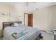 Bedroom with wood-frame bed, neutral walls, and cozy decor create a relaxing space at 8954 Sw 104Th Ln, Ocala, FL 34481