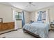 Bright bedroom with two windows, blue accents, and a cozy atmosphere at 8954 Sw 104Th Ln, Ocala, FL 34481