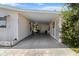 Spacious carport with lattice accents, providing convenient covered parking and stylish design at 8954 Sw 104Th Ln, Ocala, FL 34481
