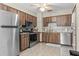 Traditional kitchen with stainless steel appliances and wood-grain cabinets at 8954 Sw 104Th Ln, Ocala, FL 34481