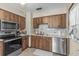 A kitchen featuring stainless steel appliances and wood cabinets at 8954 Sw 104Th Ln, Ocala, FL 34481