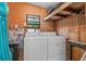 Functional laundry area with washer, dryer, and water heater, ready for immediate use at 8954 Sw 104Th Ln, Ocala, FL 34481