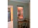 Picture through the wall into the kitchen with stainless steel appliances at 9121 Sw 83Rd Ct # C, Ocala, FL 34481