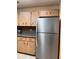 Modern kitchen with stainless steel refrigerator, stylish cabinetry, and practical layout at 9121 Sw 83Rd Ct # C, Ocala, FL 34481