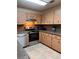 Functional kitchen featuring a stainless steel range, ample cabinets, and tile flooring at 9121 Sw 83Rd Ct # C, Ocala, FL 34481