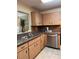 Efficient kitchen with stainless steel appliances and wood-look cabinetry at 9121 Sw 83Rd Ct # C, Ocala, FL 34481