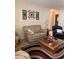 Comfortable living room with neutral tones, tile floors, and stylish decor at 9121 Sw 83Rd Ct # C, Ocala, FL 34481