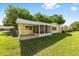 Spacious backyard featuring a screened-in porch, perfect for outdoor relaxation and entertaining at 9320 Sw 89Th Ter # C, Ocala, FL 34481
