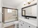 Bright bathroom with shower/tub, marble countertop vanity, and modern lighting at 9320 Sw 89Th Ter # C, Ocala, FL 34481