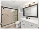 Bathroom with a walk-in shower, vanity with marble countertop, and a toilet at 9320 Sw 89Th Ter # C, Ocala, FL 34481