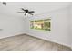 Inviting bedroom boasting a large window, neutral wall paint and light gray wood-look floors at 9320 Sw 89Th Ter # C, Ocala, FL 34481