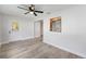 Dining room with gray wood-look floors, neutral paint and an entrance to kitchen at 9320 Sw 89Th Ter # C, Ocala, FL 34481