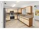 Eat in kitchen includes stainless appliances, laminate floors and plentiful cabinets at 9320 Sw 89Th Ter # C, Ocala, FL 34481