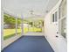 Enclosed patio with screen windows and ceiling fan at 9320 Sw 89Th Ter # C, Ocala, FL 34481