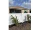 A well-maintained white fence encloses the property, complemented by lush greenery at 9764 Sw 100Th Avenue Rd, Ocala, FL 34481