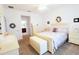 Comfortable bedroom with a neutral color palette, ample natural light, and coordinating furniture at 9764 Sw 100Th Avenue Rd, Ocala, FL 34481