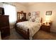 Bedroom with wooden furniture, carpet and window at 9764 Sw 100Th Avenue Rd, Ocala, FL 34481