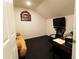 Bright bonus room with futon, desk, and TV, perfect for relaxation or a home office at 9764 Sw 100Th Avenue Rd, Ocala, FL 34481