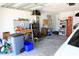 Organized two-car garage with workbench, storage cabinets, and ample space for vehicles at 9764 Sw 100Th Avenue Rd, Ocala, FL 34481