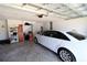 Spacious garage featuring a modern garage door opener and ample storage space with room for a car at 9764 Sw 100Th Avenue Rd, Ocala, FL 34481