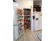 Walk-in pantry featuring organized shelving, storage, and easy access to kitchen essentials at 9764 Sw 100Th Avenue Rd, Ocala, FL 34481