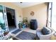 Relaxing screened-in patio with a grill, cozy seating, and view to backyard at 9764 Sw 100Th Avenue Rd, Ocala, FL 34481