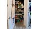 Well-organized storage closet with shelves holding linens, paper products, and other household items at 9764 Sw 100Th Avenue Rd, Ocala, FL 34481