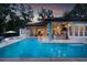 Gorgeous backyard pool with an outdoor kitchen and bar area perfect for entertaining at 0000 Se 17Th Ct, Ocala, FL 34471