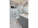 Modern bathroom with a glass shower, gray vanity, and contemporary design at 0000 Se 17Th Ct, Ocala, FL 34471