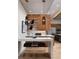 Stylish kitchen bar with modern lighting, seating, and wine storage at 0000 Se 17Th Ct, Ocala, FL 34471