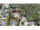 Ariel shot of undeveloped, vacant, lot surrounded by a red line, trees, and existing homes at 0000 Se 17Th Ct, Ocala, FL 34471