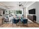 Bright living room featuring modern furniture, stylish decor, and hardwood floors at 0000 Se 17Th Ct, Ocala, FL 34471