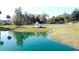 Idyllic pond view with a gazebo and tennis court, adding charm to the community's landscape at 0000 Se 17Th Ct, Ocala, FL 34471