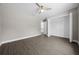 Spacious bedroom featuring wood-look flooring, closet and ceiling fan at 10435 Se 125 Ln, Belleview, FL 34420
