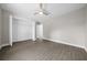 Bright bedroom featuring wood-look flooring, closet, ceiling fan, and neutral paint at 10435 Se 125 Ln, Belleview, FL 34420