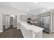 Bright kitchen features stainless steel appliances, quartz countertops, and gray cabinetry at 10435 Se 125 Ln, Belleview, FL 34420